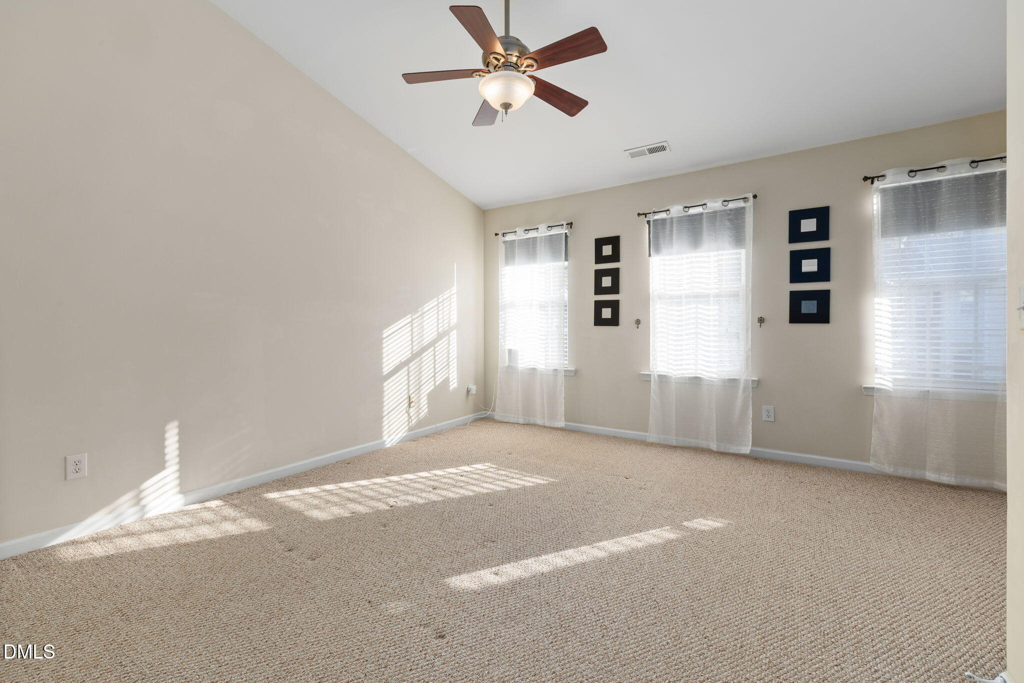 4424 Sugarbend Way Raleigh, NC 27606 - Photo 25 of 38 a view of a livingroom with a ceiling fan and window