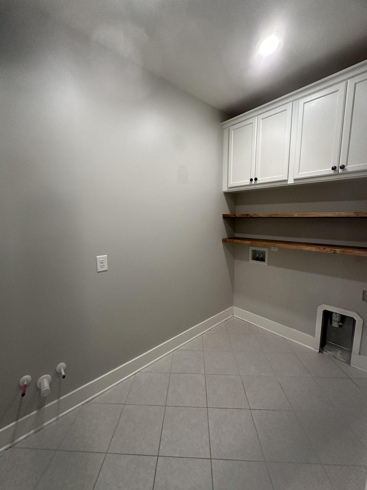 716 Plowson Road Mount Juliet, TN 37122 - Photo 30 of 40 Laundry Room with built in shelving and cabinets for storage