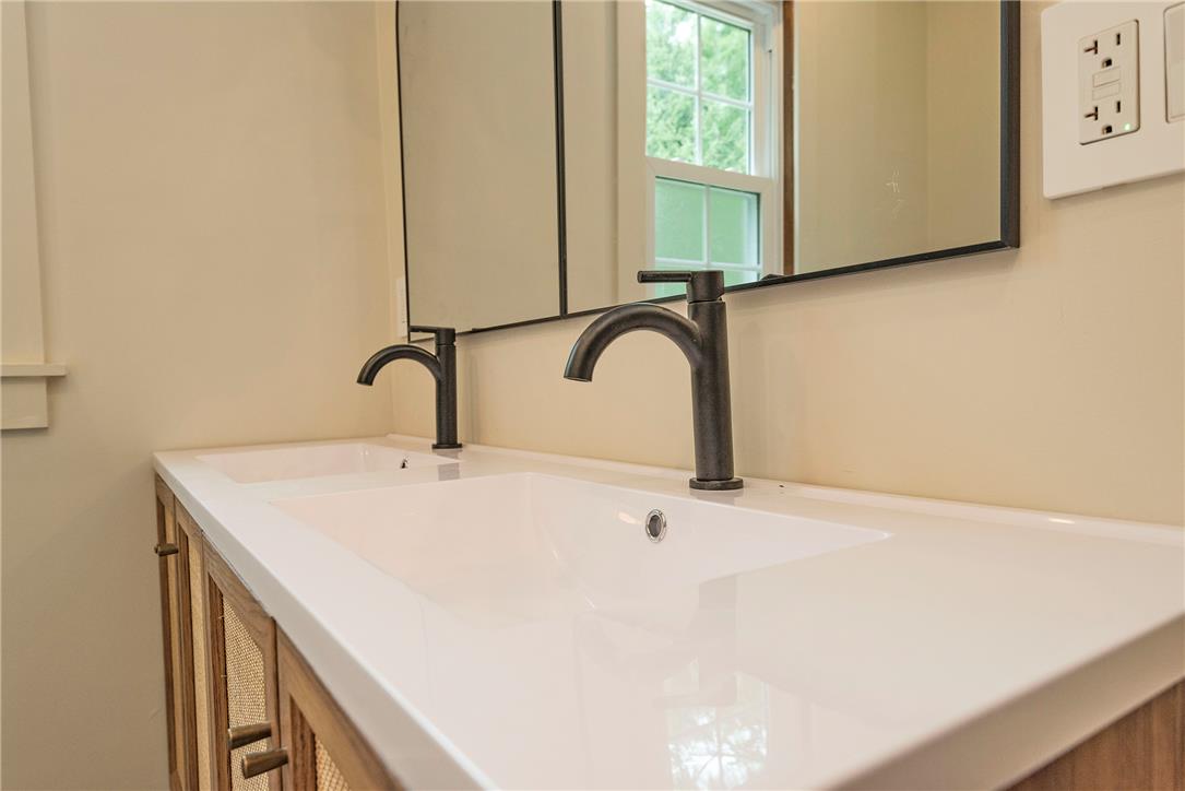 100 Creek Road Bangor, PA 18013 - Photo 32 of 51 Double vanities with sleek dark bronze fixtures highlight this modern bathroom's design.