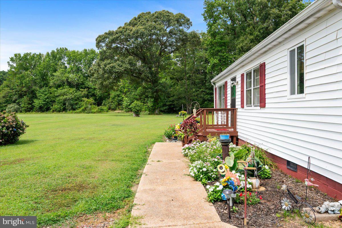 141 Raintree Lane Reedville, VA 22539 - Photo 36 of 86 Charming home with lush green surroundings.