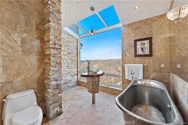 a bathroom with a toilet and a sink