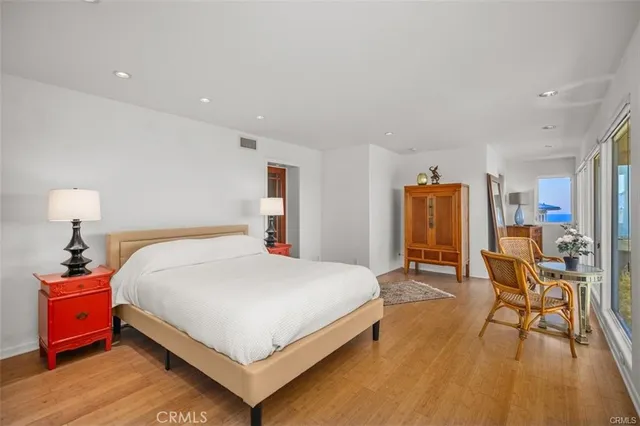 a bedroom with a bed and a table