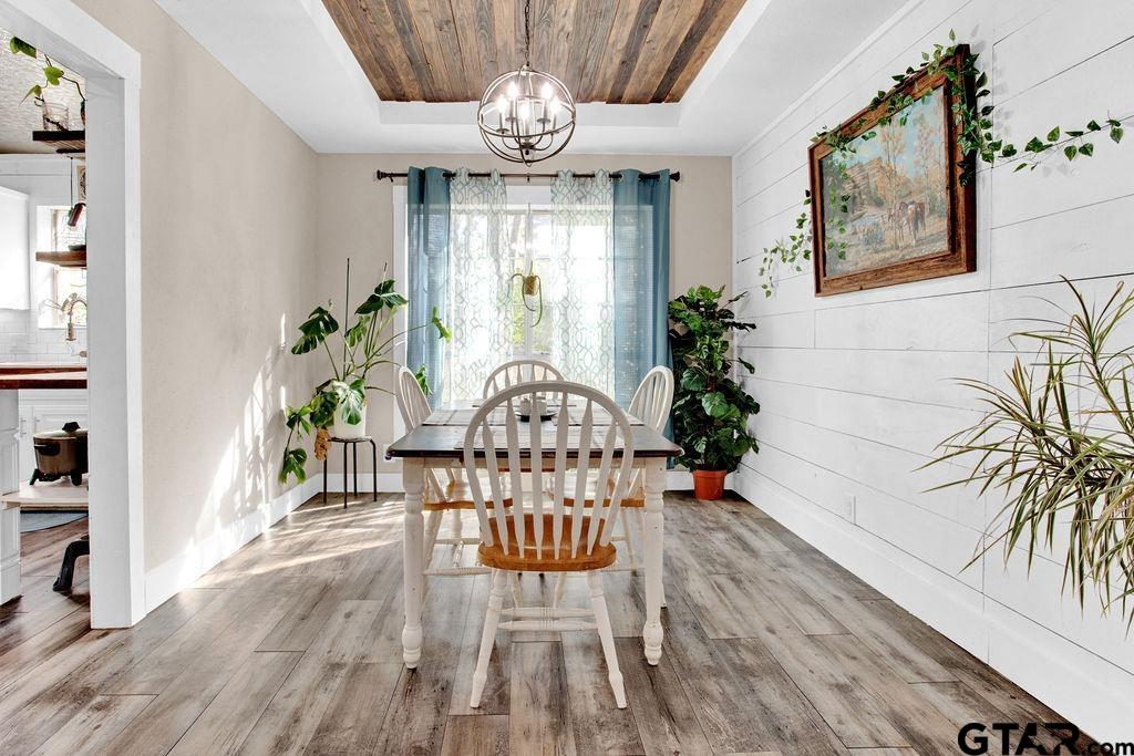 1339 Bridle Path Lane Hideaway, TX 75771 - Photo 19 of 41 a view of a dining room with furniture wooden floor and chandelier