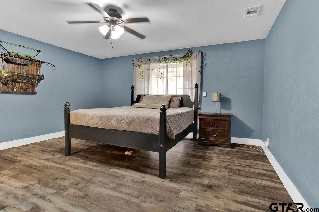 1339 Bridle Path Lane Hideaway, TX 75771 - Photo 20 of 41 a bed room with a bed and a window
