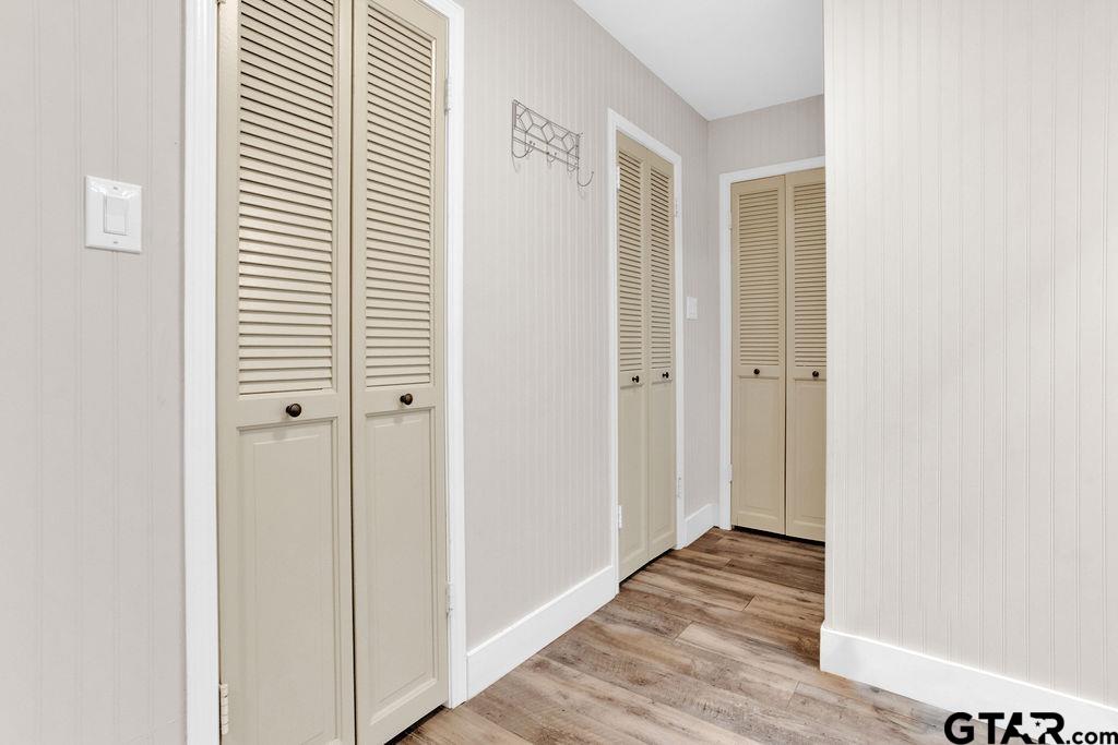 1339 Bridle Path Lane Hideaway, TX 75771 - Photo 24 of 41 a view of a hallway with wooden floor