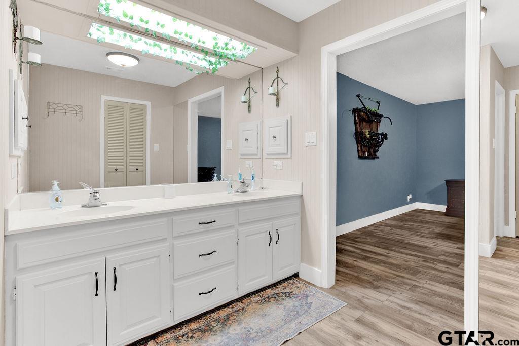 1339 Bridle Path Lane Hideaway, TX 75771 - Photo 25 of 41 a bathroom with a double vanity sink and a mirror