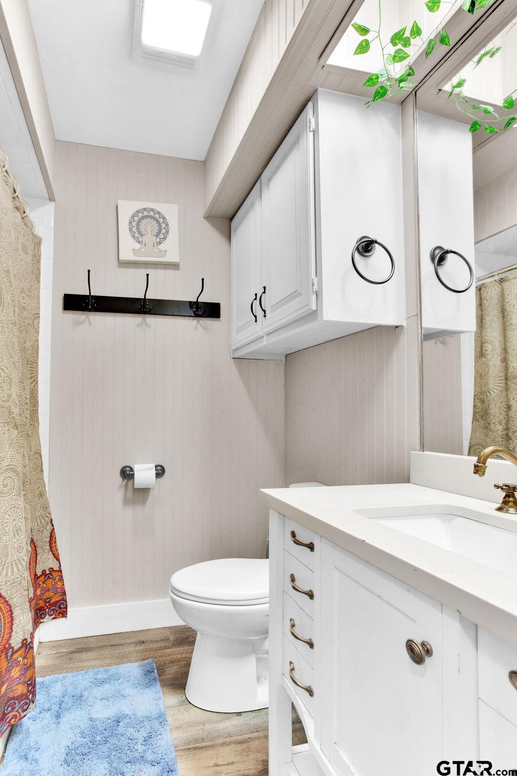 1339 Bridle Path Lane Hideaway, TX 75771 - Photo 30 of 41 a bathroom with a sink a toilet and shower