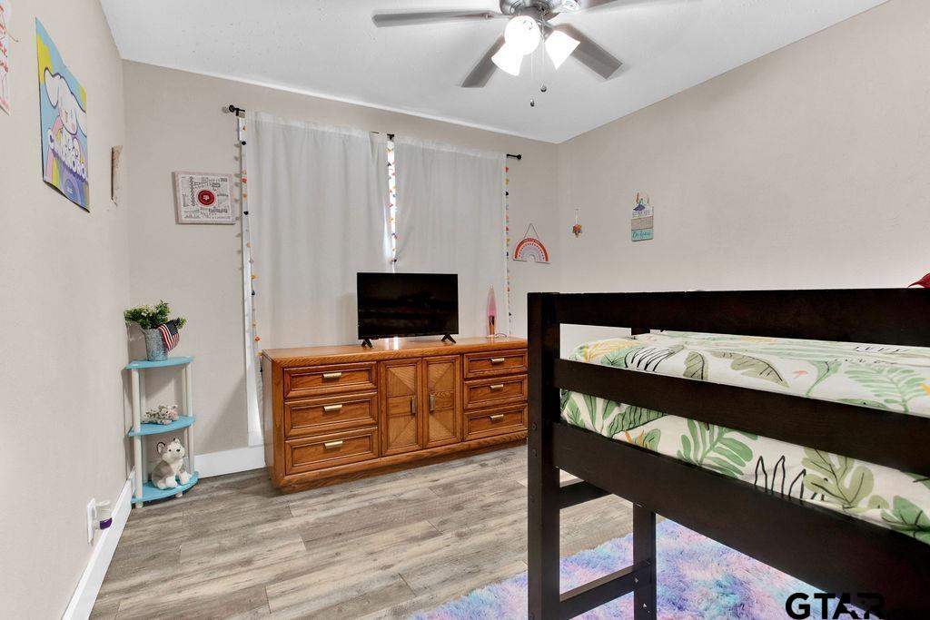 1339 Bridle Path Lane Hideaway, TX 75771 - Photo 31 of 41 a living room with furniture and flat screen tv
