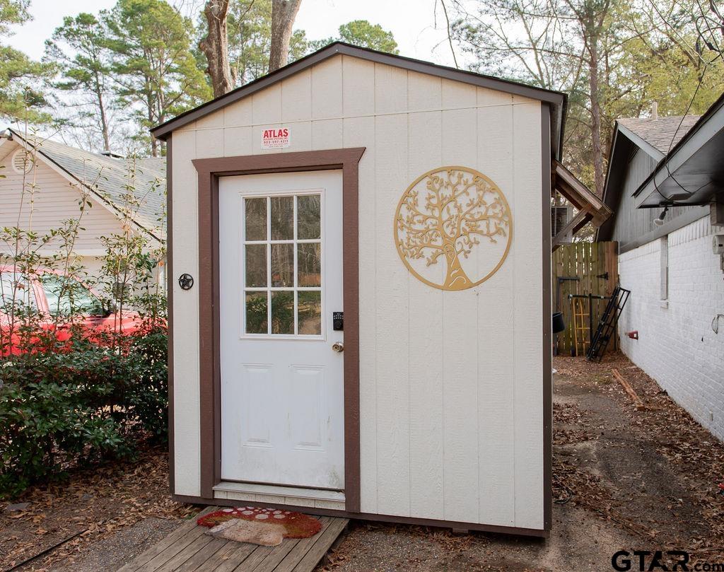 1339 Bridle Path Lane Hideaway, TX 75771 - Photo 33 of 41 a view of a house with a small yard