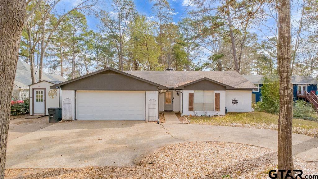 1339 Bridle Path Lane Hideaway, TX 75771 - Photo 41 of 41 a front view of a house with a yard and garage