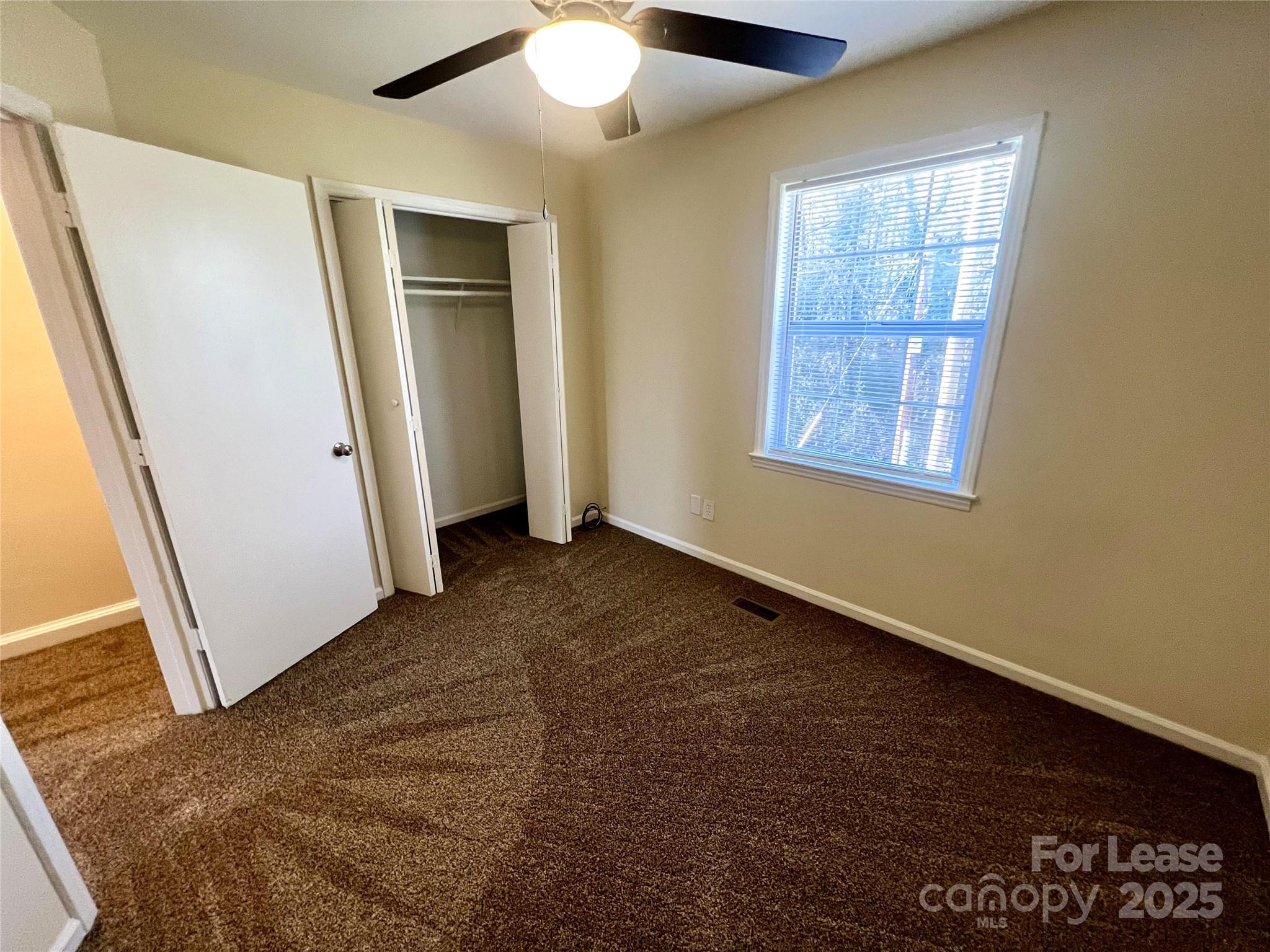 250 Nixon Road, Unit 34 Belmont, NC 28012 - Photo 11 of 11 an empty room with windows