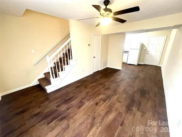 a view of an entryway with wooden floor