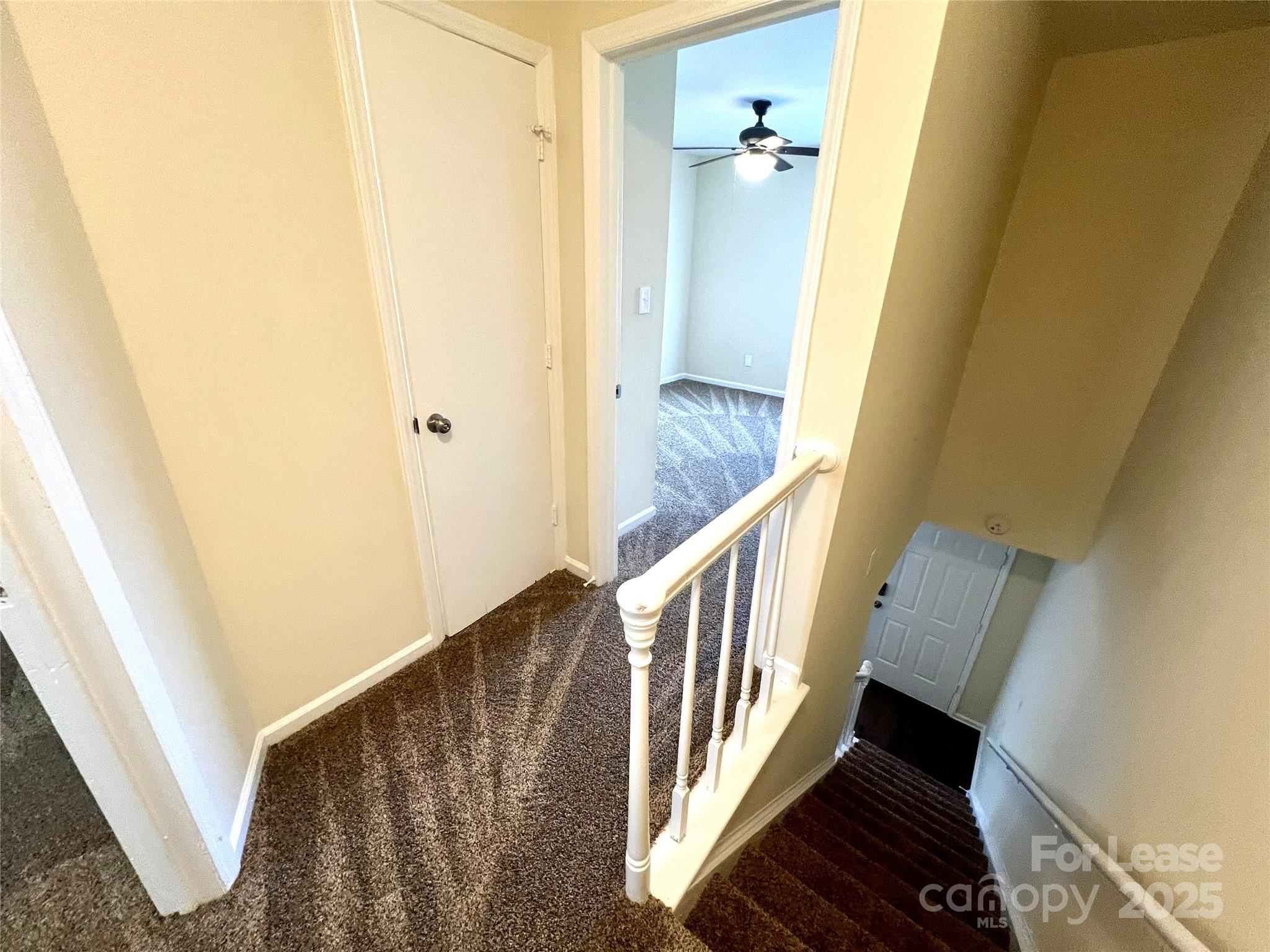 250 Nixon Road, Unit 34 Belmont, NC 28012 - Photo 6 of 11 a view of a hallway view with wooden floor and staircase