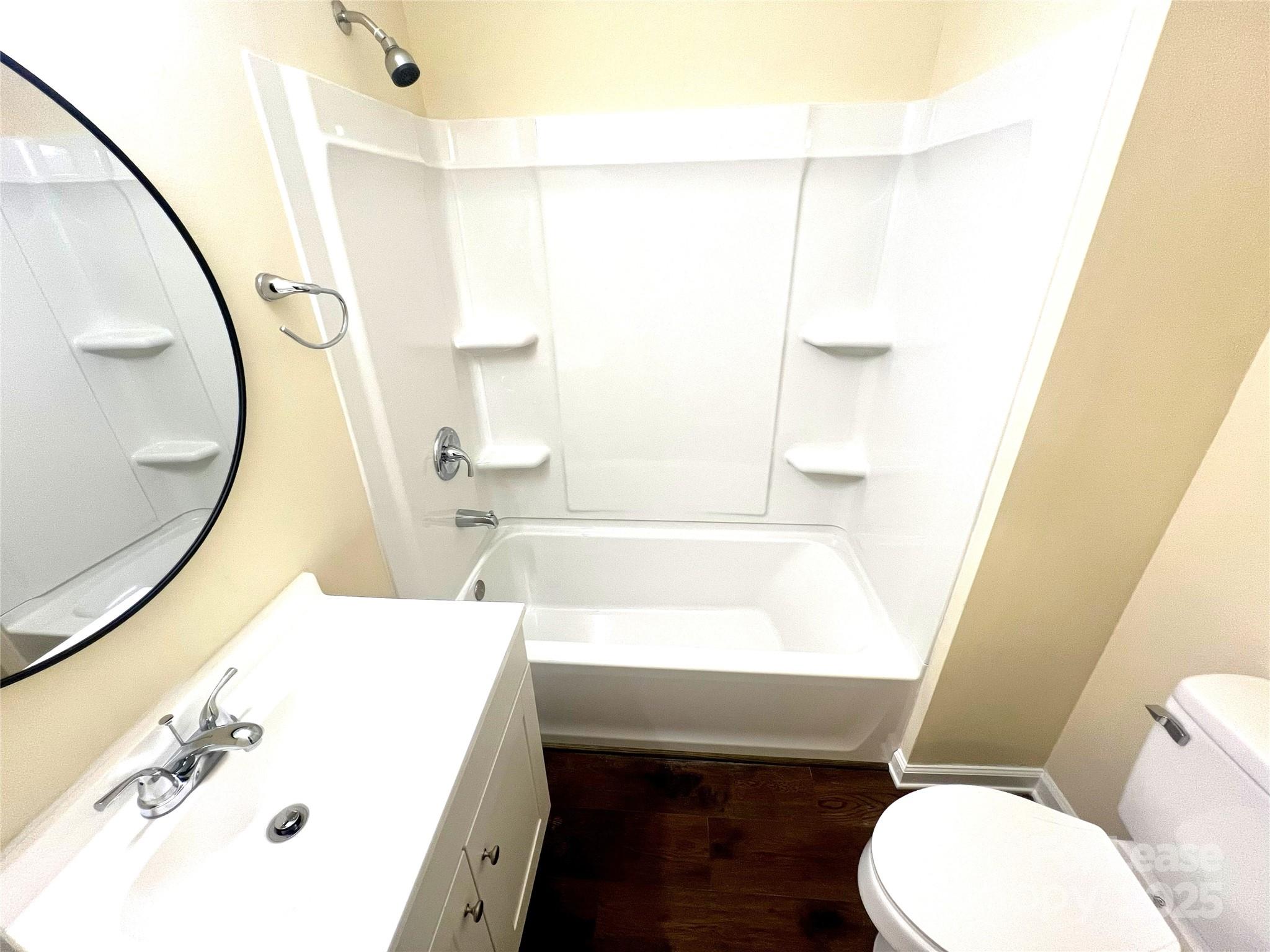 250 Nixon Road, Unit 34 Belmont, NC 28012 - Photo 9 of 11 a bathroom with a sink a toilet and a mirror