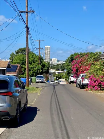a view of a street with cars