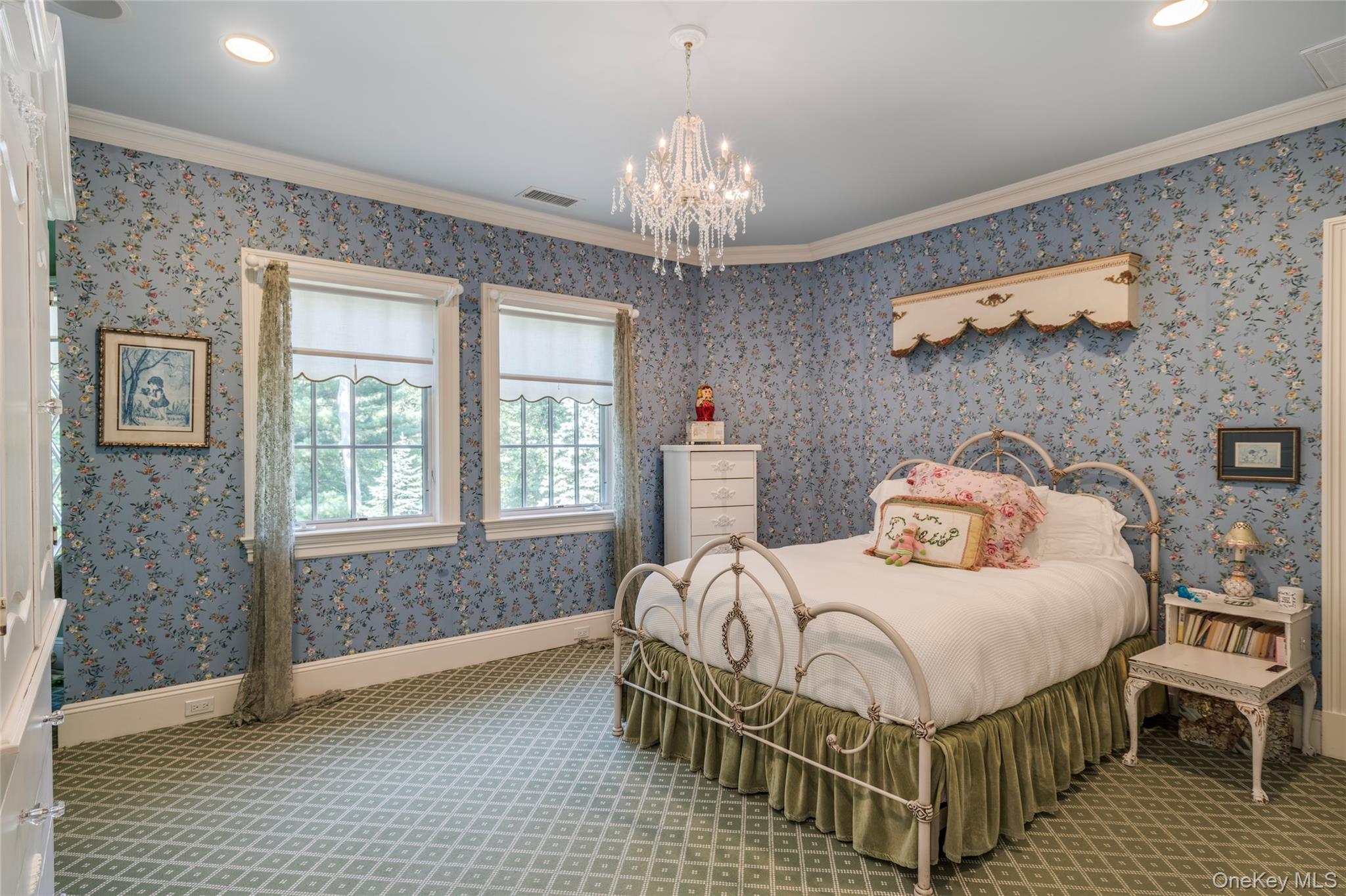 178 Brookville Road Muttontown, NY 11545 - Photo 17 of 29 a bedroom with a bed and a chandelier