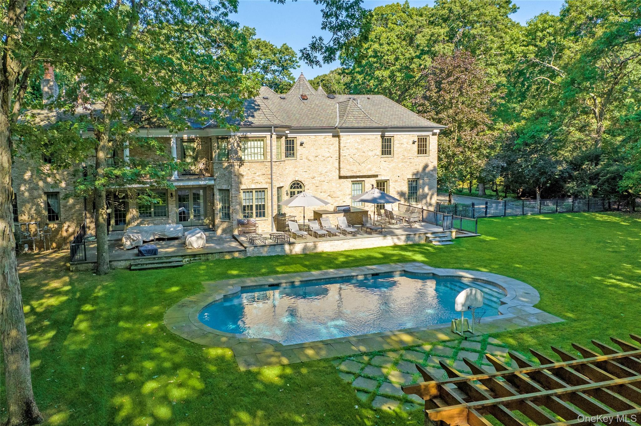 178 Brookville Road Muttontown, NY 11545 - Photo 24 of 29 a swimming pool view with a outdoor seating