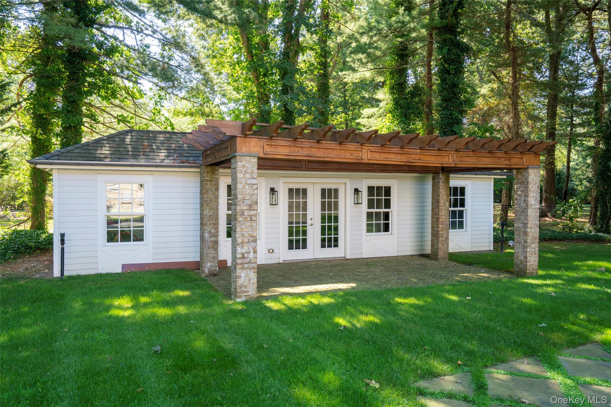 178 Brookville Road Muttontown, NY 11545 - Photo 27 of 29 front view of a house with a yard