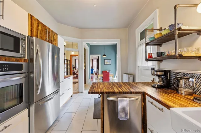 a spacious bathroom with a toilet sink and mirror