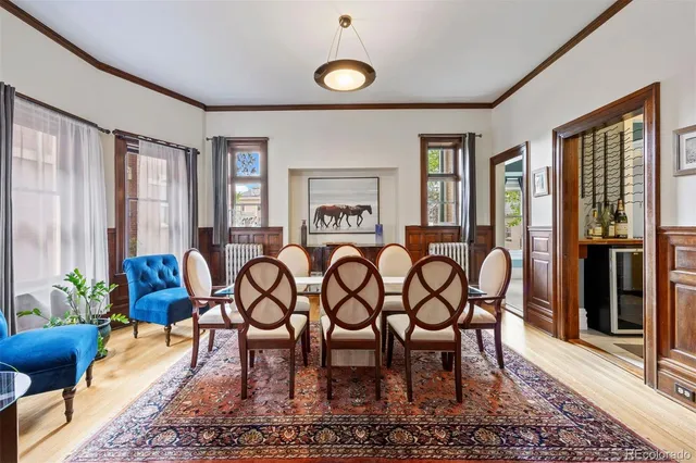 a living room with furniture a flat screen tv and a window