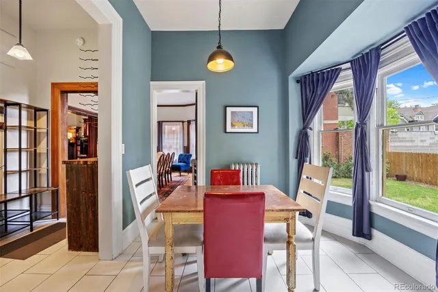 a living room with furniture and a book shelf