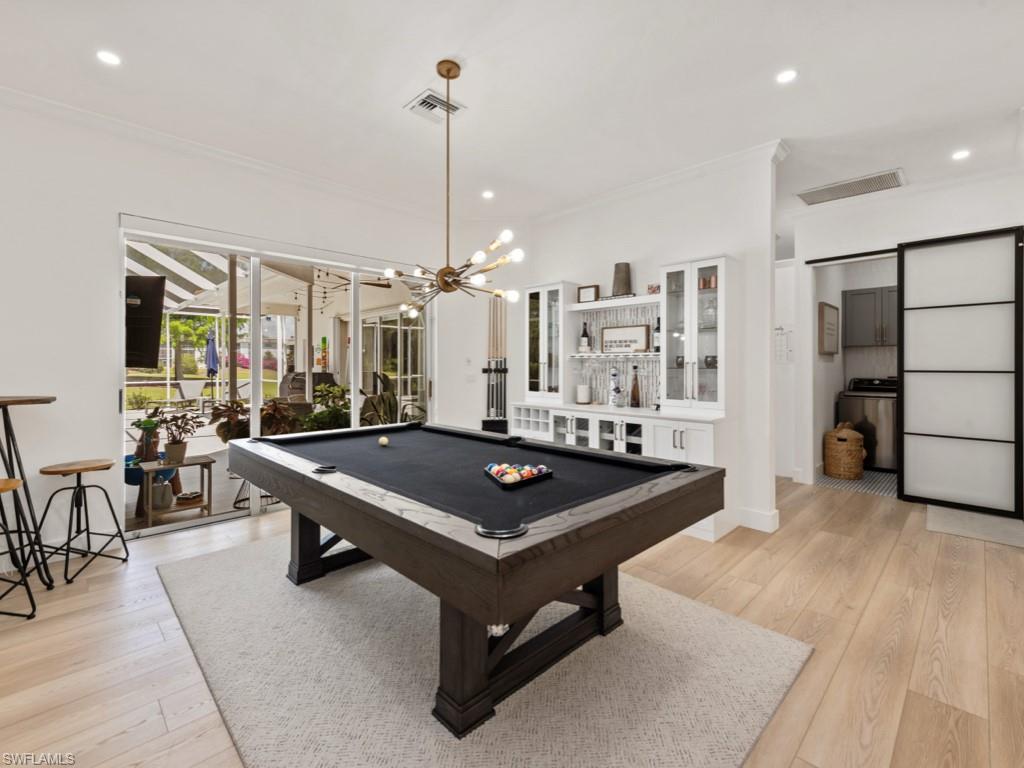 206 Palmetto Dunes Circle Naples, FL 34113 - Photo 12 of 34 a room with pool table and windows