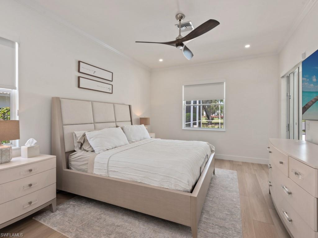 206 Palmetto Dunes Circle Naples, FL 34113 - Photo 15 of 34 a bedroom with a bed and a window