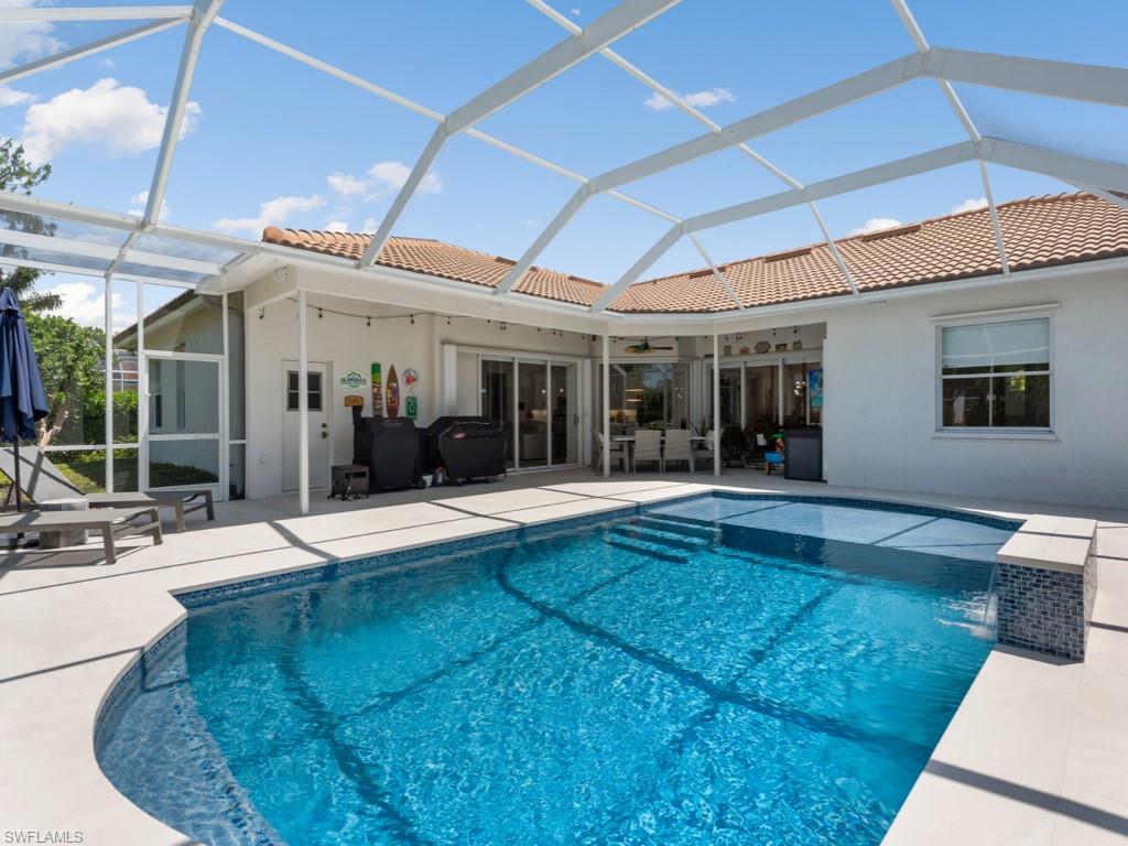 206 Palmetto Dunes Circle Naples, FL 34113 - Photo 27 of 34 a view of a house with sitting area and furniture