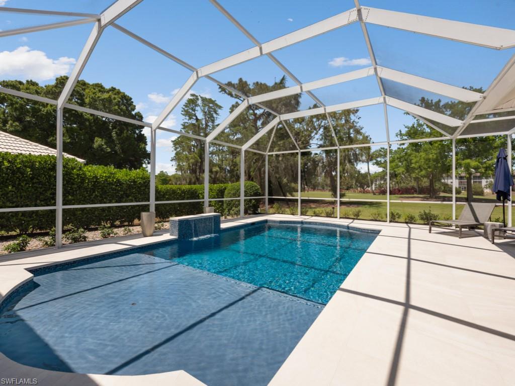 206 Palmetto Dunes Circle Naples, FL 34113 - Photo 28 of 34 a view of a backyard with sitting area