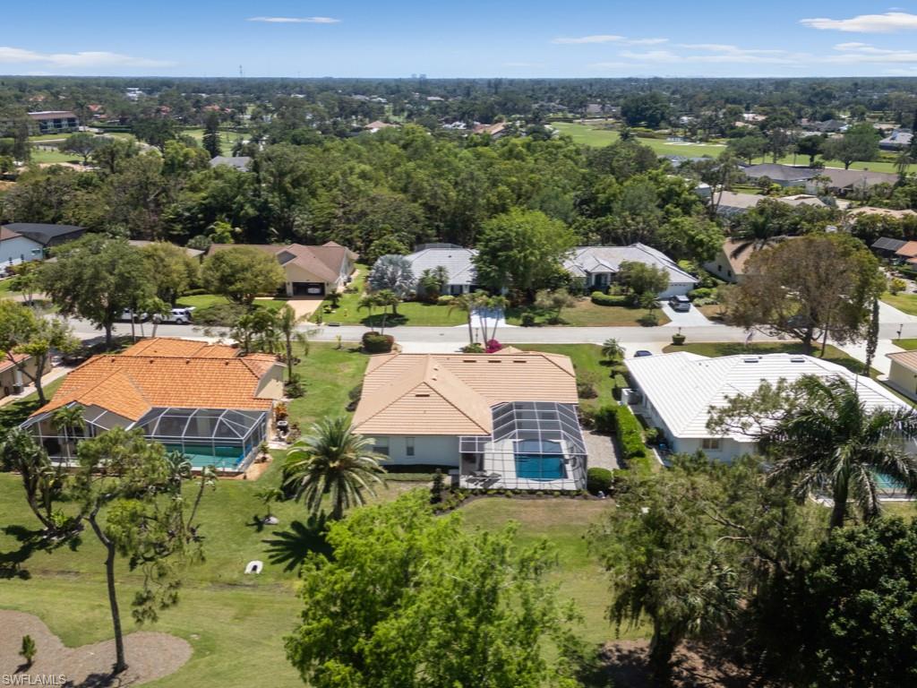 206 Palmetto Dunes Circle Naples, FL 34113 - Photo 3 of 34 an aerial view of a house with a garden