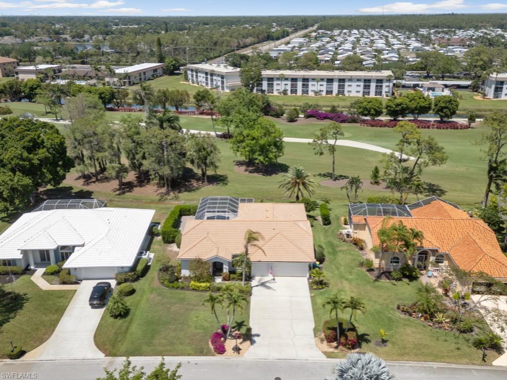206 Palmetto Dunes Circle Naples, FL 34113 - Photo 30 of 34 an aerial view of houses with yard