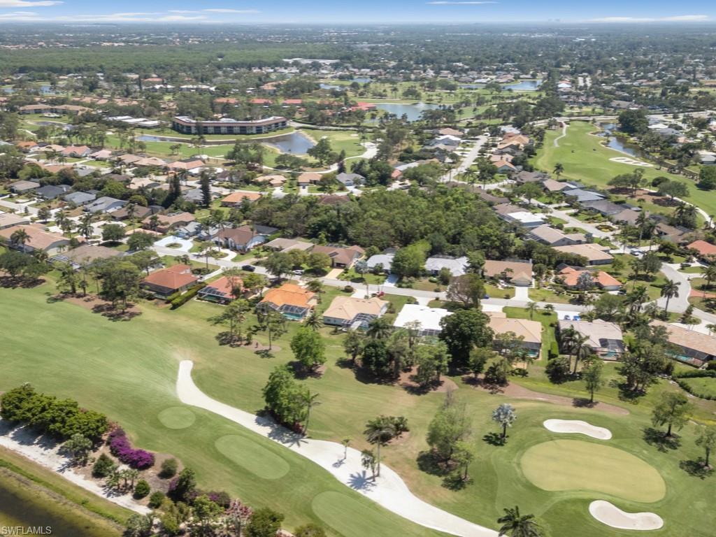 206 Palmetto Dunes Circle Naples, FL 34113 - Photo 32 of 34 an aerial view of residential houses with outdoor space