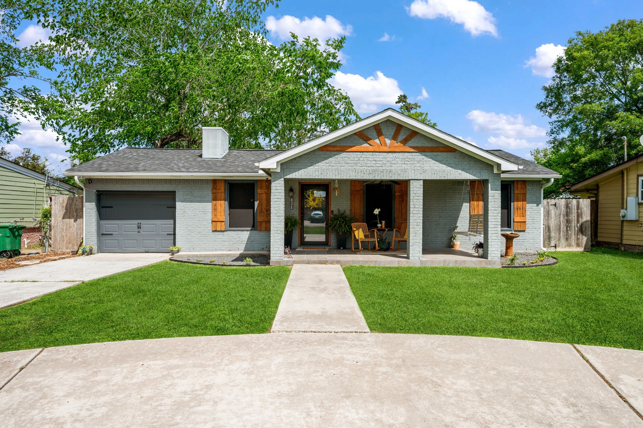 431 Corydon Drive Houston, TX 77336 - Photo 1 of 26 Gorgeous front elevation with warm wood accents, and a covered front porch. The inviting façade sets the tone for the home’s welcoming interior.