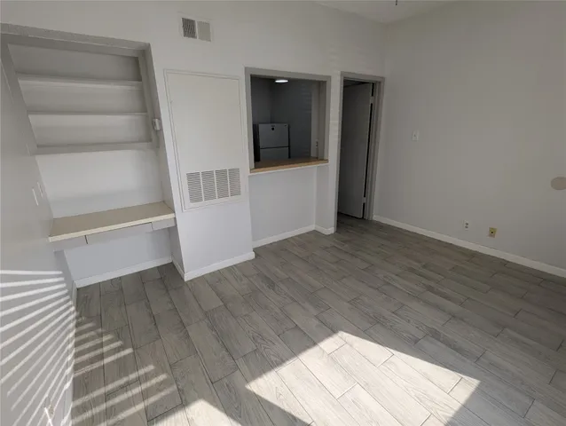 a kitchen with a stove and a refrigerator