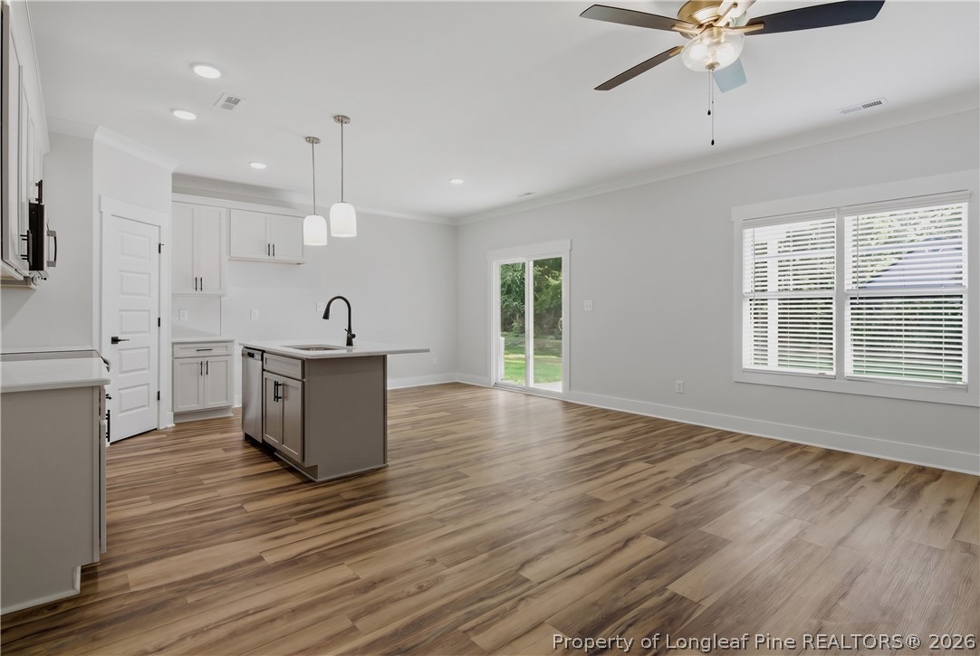 3931 Hamilton Street Hope Mills, NC 28348 - Photo 11 of 50 a view of kitchen with wooden floor and window