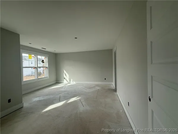 a view of empty room with windows