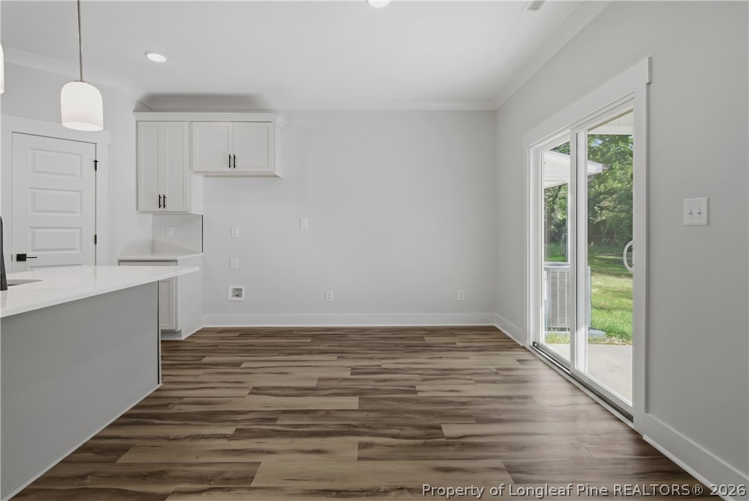 3931 Hamilton Street Hope Mills, NC 28348 - Photo 18 of 50 a view of a kitchen with wooden floor and a sink