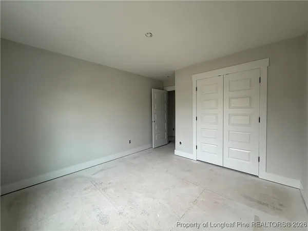 a view of a room with air conditioner and a window