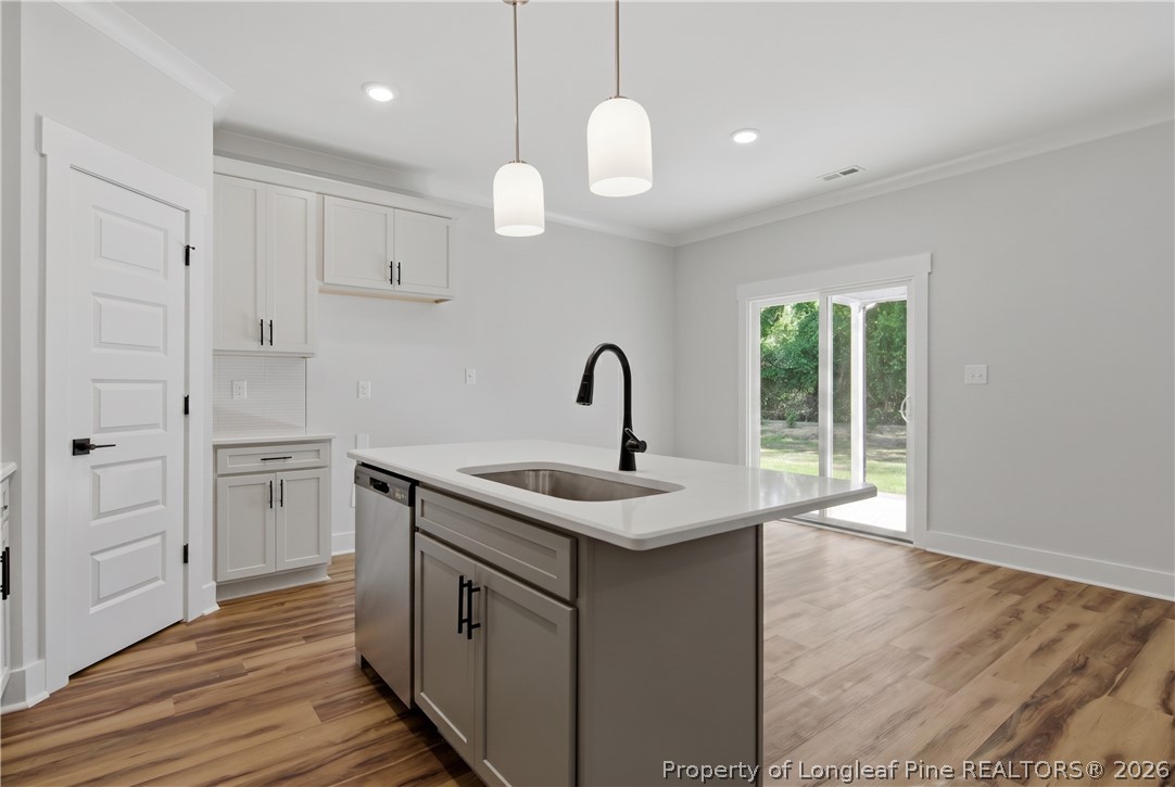3931 Hamilton Street Hope Mills, NC 28348 - Photo 23 of 50 a kitchen with a sink and wooden floor