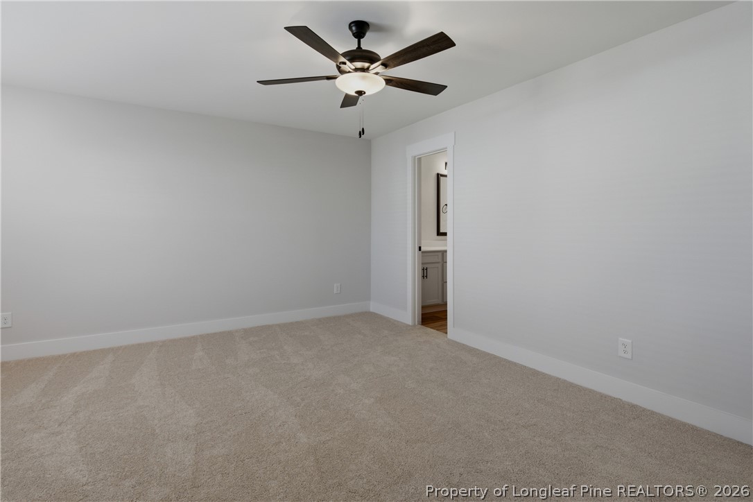 3931 Hamilton Street Hope Mills, NC 28348 - Photo 30 of 50 an empty room with a ceiling fan and a ceiling fan