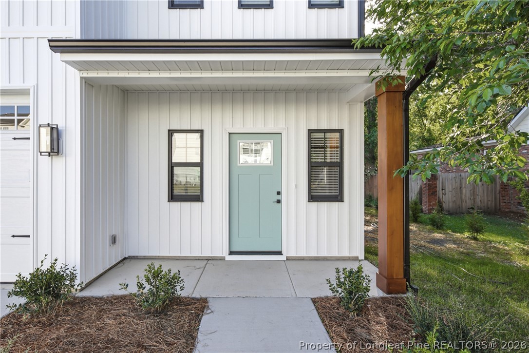 3931 Hamilton Street Hope Mills, NC 28348 - Photo 5 of 50 a front view of a house with garden