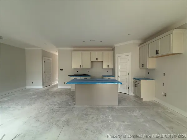 a kitchen with a sink cabinets and stainless steel appliances