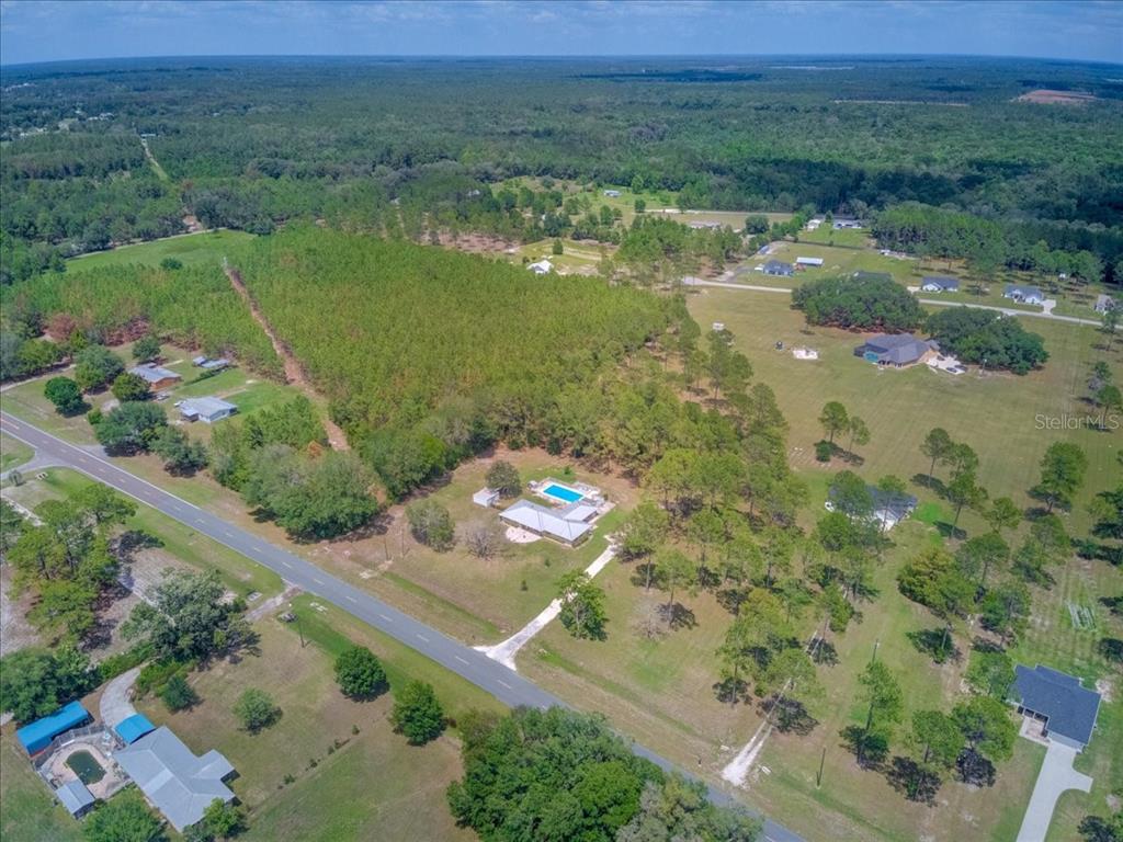 7422 County Road 231 Lake Butler, FL 32054 - Photo 52 of 57 a view of a lake with a yard