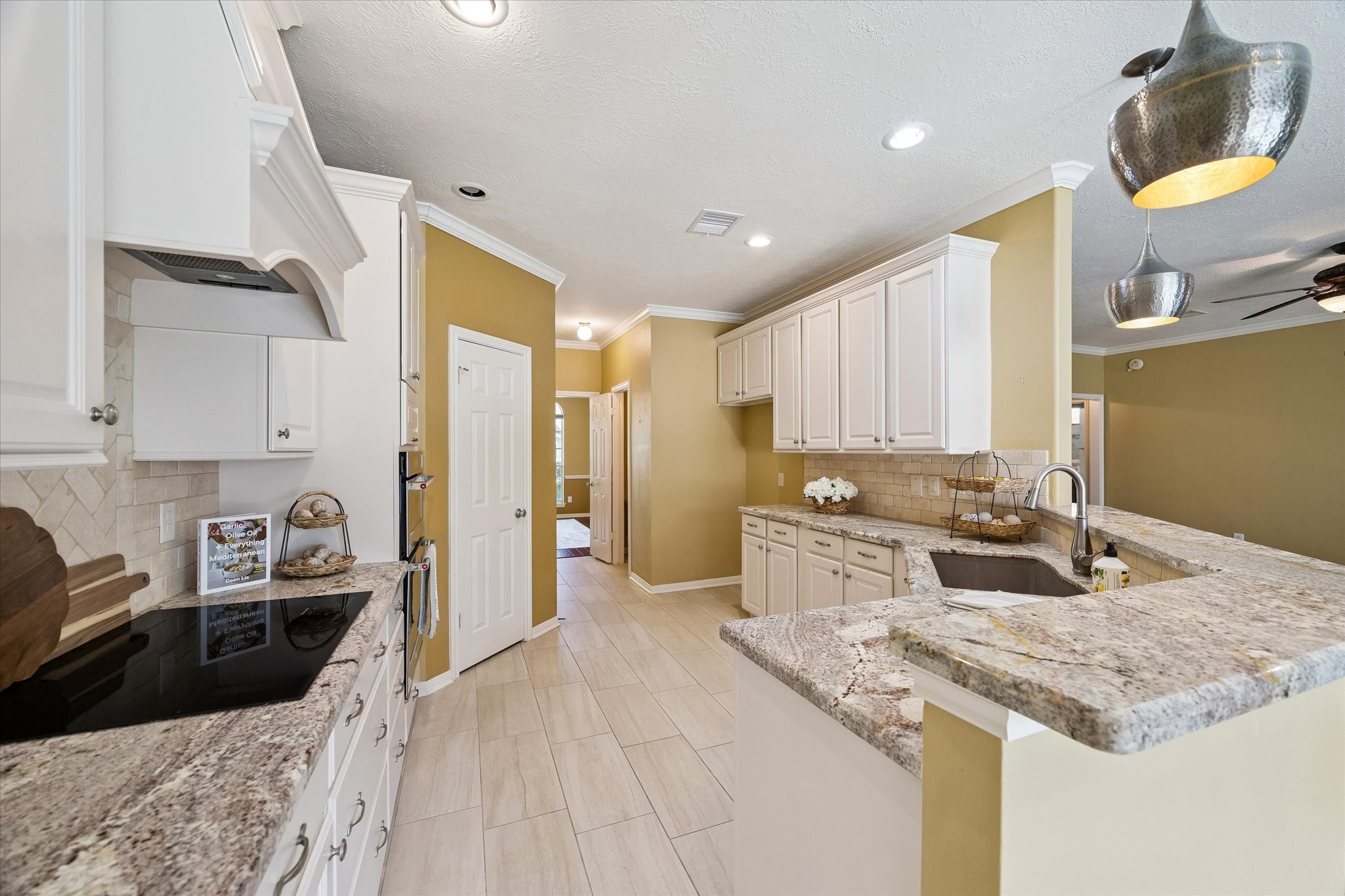 3007 Sycamore Tree Court Houston, TX 77345 - Photo 11 of 24 a kitchen with a sink stove and refrigerator