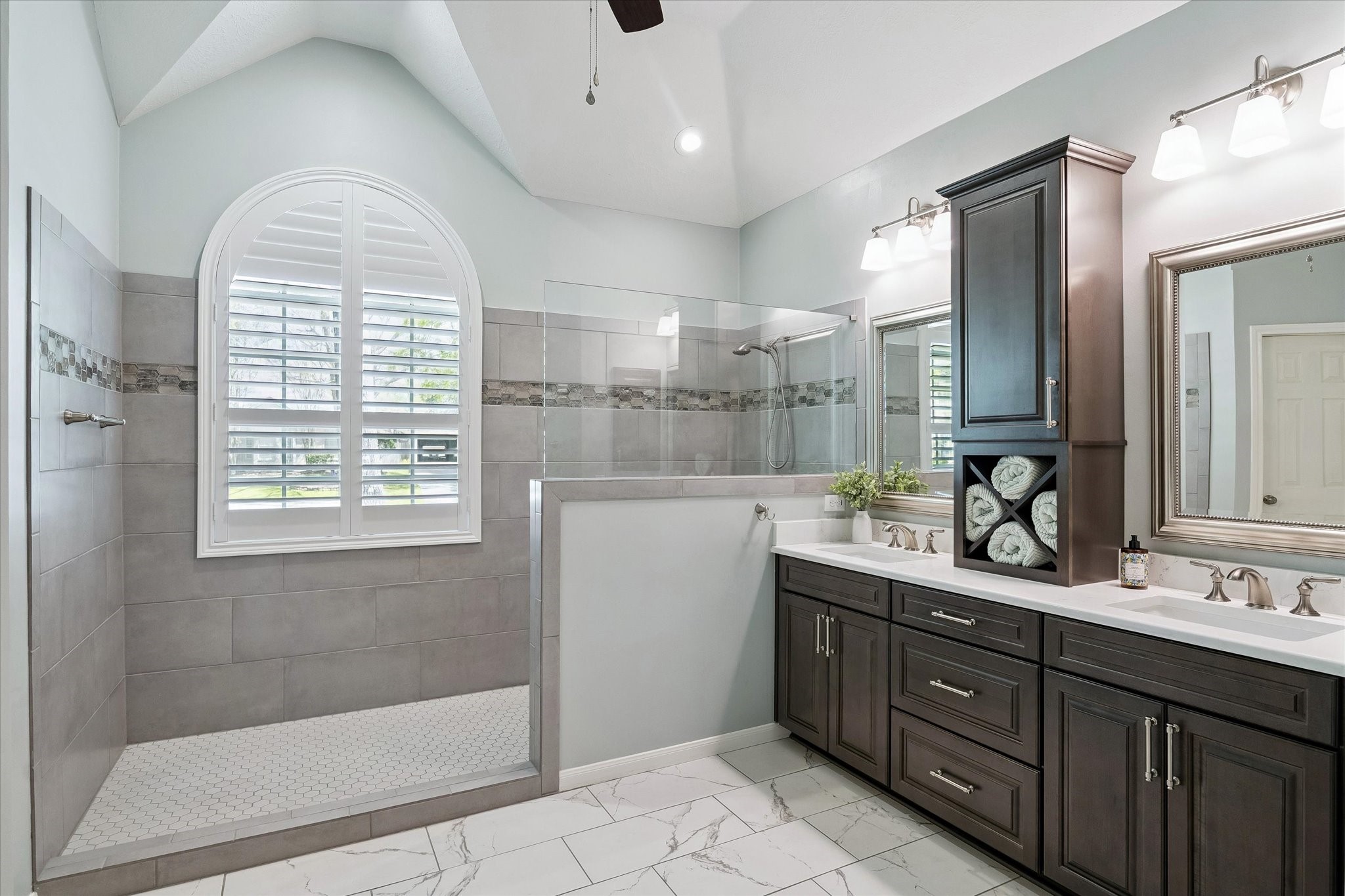 3007 Sycamore Tree Court Houston, TX 77345 - Photo 15 of 24 a bathroom with a double vanity sink a mirror and a shower