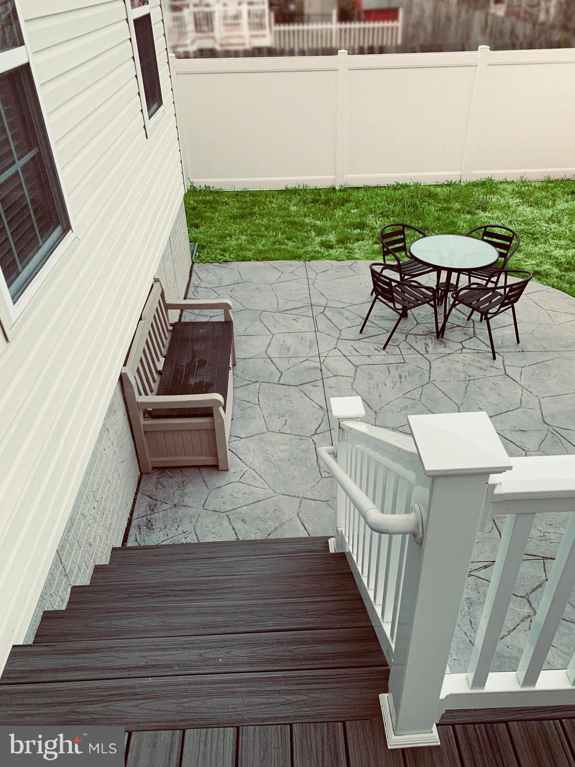 177 Dale Road Pasadena, MD 21122 - Photo 35 of 46 Trex deck leading to paved patio