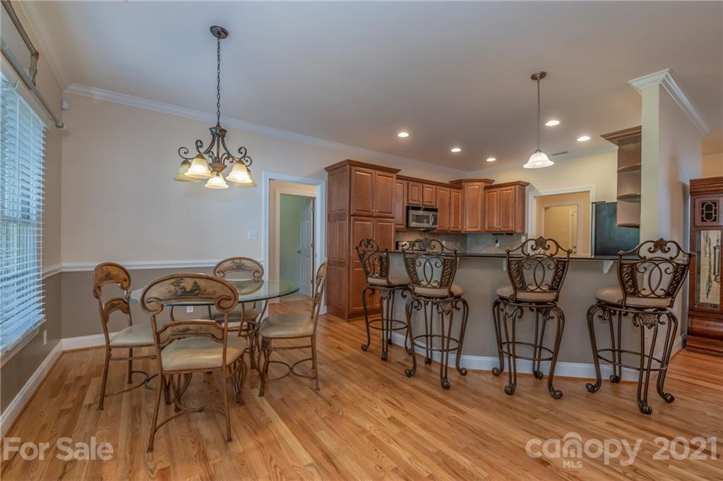 456 Cobblestone Drive Inman, SC 29349 - Photo 15 of 36 a view of a dining room with furniture and chandelier
