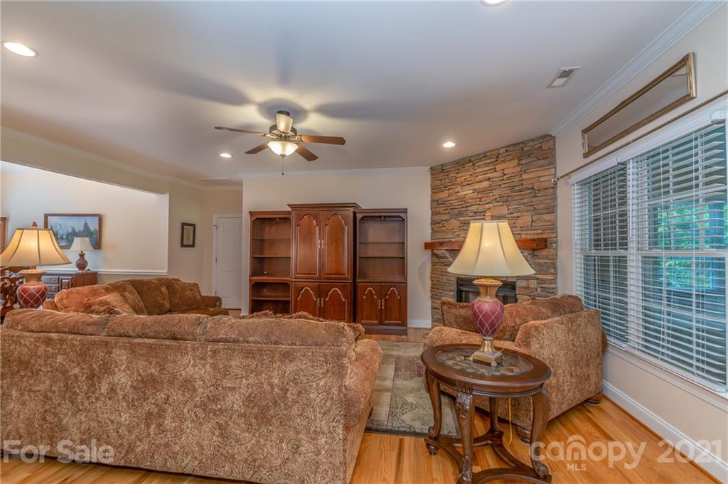 456 Cobblestone Drive Inman, SC 29349 - Photo 18 of 36 a living room with furniture and a chandelier