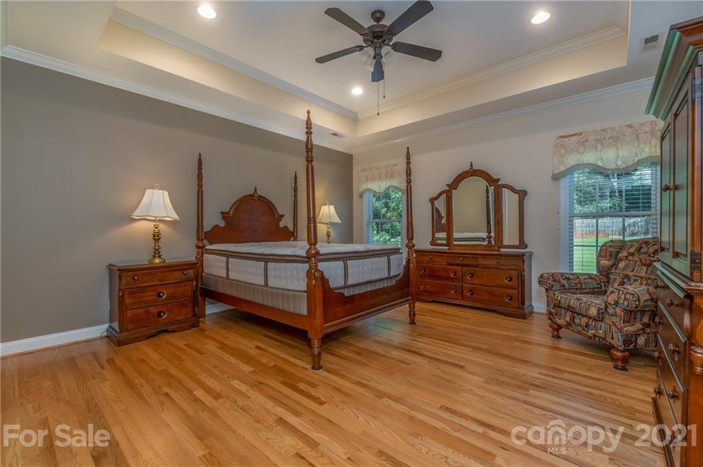 456 Cobblestone Drive Inman, SC 29349 - Photo 21 of 36 a bedroom with furniture and wooden floor