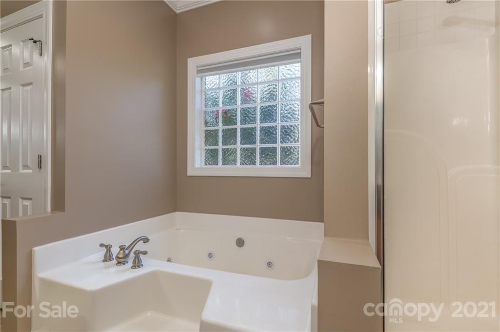 456 Cobblestone Drive Inman, SC 29349 - Photo 24 of 36 a white bath tub sitting next to a white sink